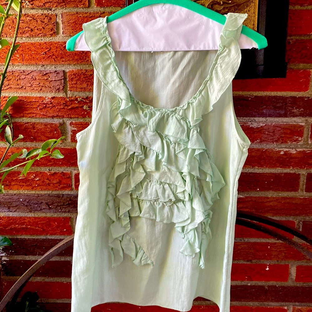 Light green sleeveless blouse